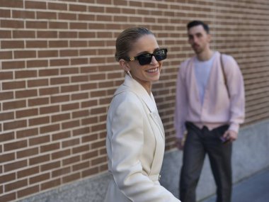 Fashion blogger Caroline Daur walking in the street before Fendi fashion show during Milano fashion week woman fall/winter collections