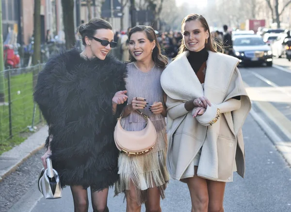 Fashion blogger Karina Nigai, Mary Leest and Kasia walking in the street after Fendi fashion show during Milano fashion week woman fall/winter collections