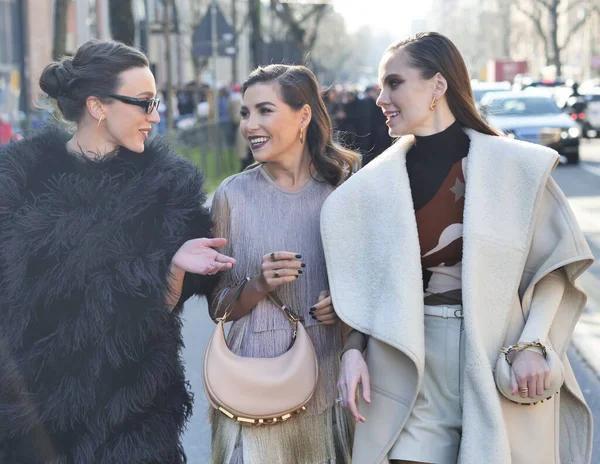 Fashion blogger Karina Nigai, Mary Leest and Kasia walking in the street after Fendi fashion show during Milano fashion week woman fall/winter collections