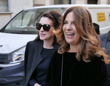 Anne Hathaway and Roberta Armani walking in the street before Armani fashion show during Milano fashion week fall/winter woman collections 2022