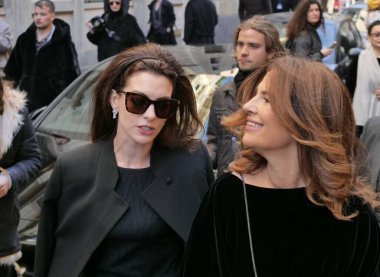 Anne Hathaway and Roberta Armani walking in the street before Armani fashion show during Milano fashion week fall/winter woman collections 2022