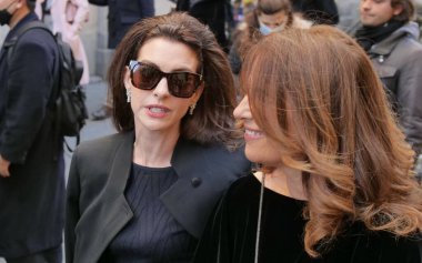 Anne Hathaway and Roberta Armani walking in the street before Armani fashion show during Milano fashion week fall/winter woman collections 2022