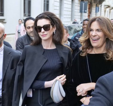 Anne Hathaway and Roberta Armani walking in the street before Armani fashion show during Milano fashion week fall/winter woman collections 2022