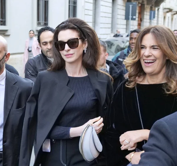 Anne Hathaway and Roberta Armani walking in the street before Armani fashion show during Milano fashion week fall/winter woman collections 2022