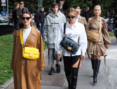 Fashion bloggers street style outfits after and before Fendi fashion show during Milano fashion Week woman spring/summer collections