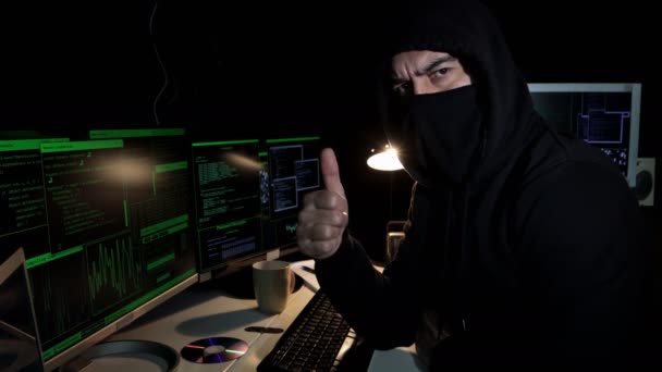 Cyber Hacker Hood Covered Face Looks Camera Showing Thumb Hand — Stockvideo