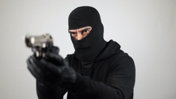 Man Black Balaclava Holding Pointing Pistol White Background Crime Concept — Stock Video