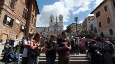Rome, Italy - April 25, 2022: Time lapse of the beautiful staircase of the famous Spanish Steps in Rome with crowd of people.