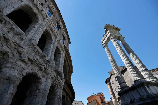 stock image The Marcellus theater and the three columns of the temple of Apollo Sosiano in Rome, Italy.