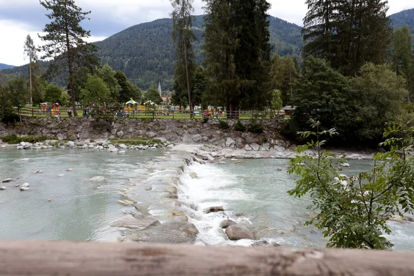The Sarca River flows through the alpine town of Pinzolo in Trentino, Italy.