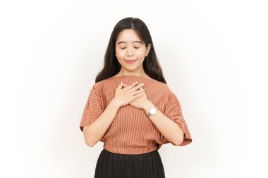 Beyaz arka planda tecrit edilmiş Asyalı Güzel Kadın 'ın Minnettar ya da Kendine Sevgi Hareketi