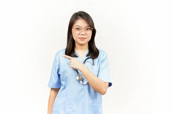 Showing Product Pointing Side Asian Young Doctor Isolated White Background — Stock Photo, Image