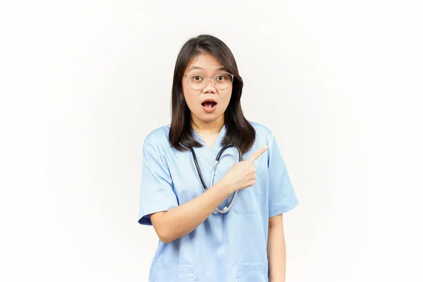 Showing Product Pointing Side Asian Young Doctor Isolated White Background — Stock Photo, Image