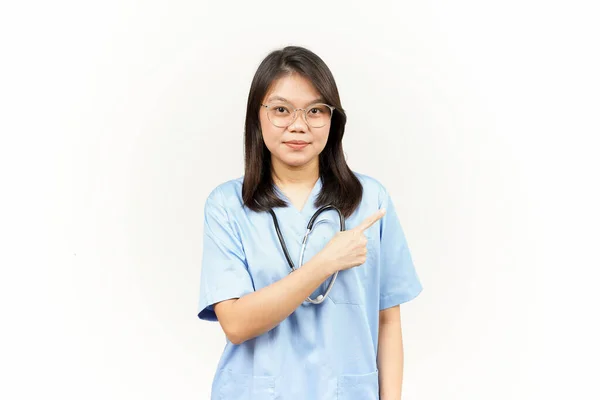 Showing Product Pointing Side Asian Young Doctor Isolated White Background — Stock Photo, Image