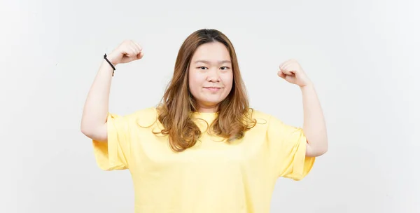 Showing Strength Arms Beautiful Asian Woman Wearing Yellow Shirt Isolated — Stok fotoğraf