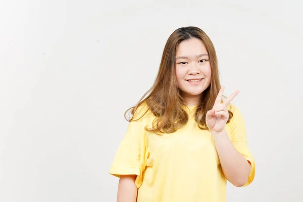 Showing Peace Sign Beautiful Asian Woman Wearing Yellow Shirt Isolated —  Fotos de Stock