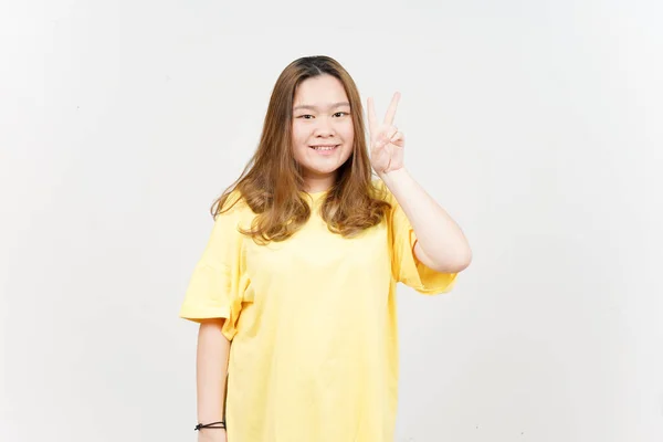 Showing Peace Sign Beautiful Asian Woman Wearing Yellow Shirt Isolated — 스톡 사진