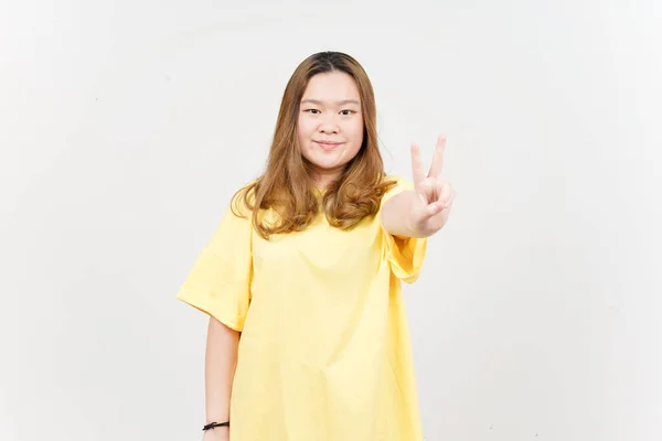 Showing Peace Sign Beautiful Asian Woman Wearing Yellow Shirt Isolated — 스톡 사진