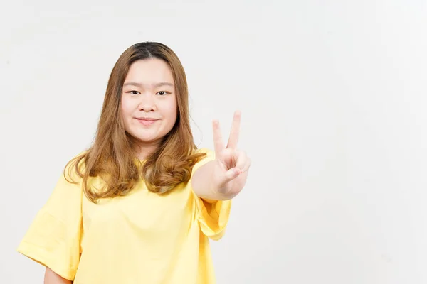 Showing Peace Sign Beautiful Asian Woman Wearing Yellow Shirt Isolated —  Fotos de Stock