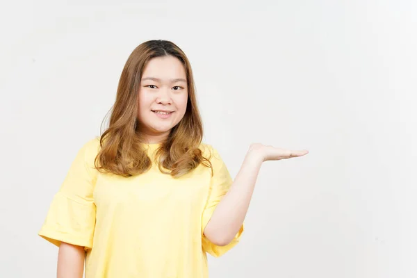 Showing Presenting Product Open Palm Beautiful Asian Woman Wearing Yellow — Fotografia de Stock