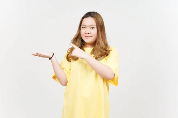 Showing Presenting Product Open Palm Beautiful Asian Woman Wearing Yellow — Stock Photo, Image