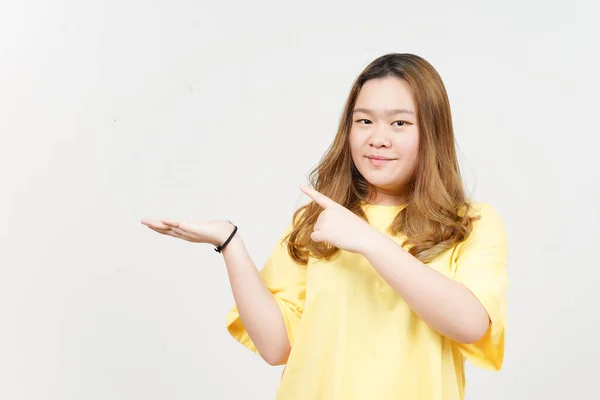 Showing Presenting Product Open Palm Beautiful Asian Woman Wearing Yellow — Stockfoto