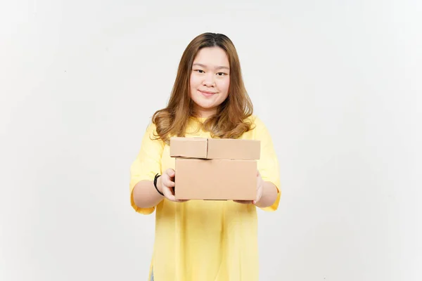 Holding Package Box or Cardboard Box of Beautiful Asian Woman wearing yellow T-Shirt