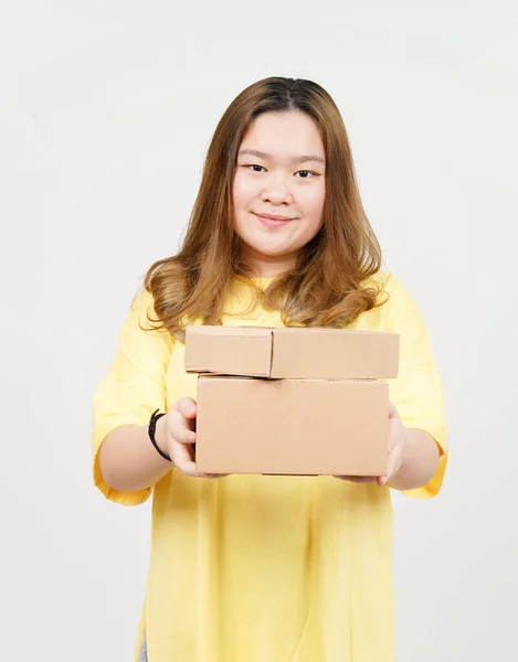 Holding Package Box or Cardboard Box of Beautiful Asian Woman wearing yellow T-Shirt