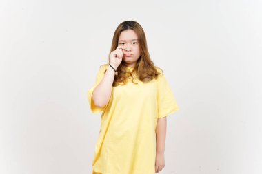 Sad Crying Face Expression of Beautiful Asian Woman wearing yellow T-Shirt Isolated On White