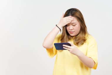 Using Smartphone of Beautiful Asian Woman wearing yellow T-Shirt Isolated On White Background