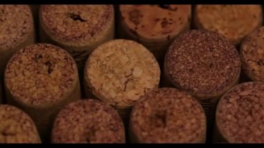 Background of rotating used wine corks close-up.
