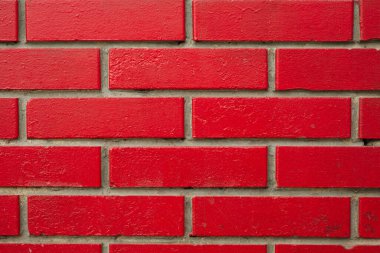 Bricks painted red. Texture, background for design, backdrop.