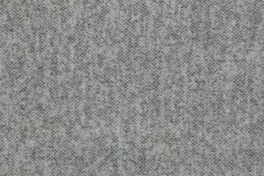 Texture of gray-white finely knitted fabric. Background for design. Backdrop.