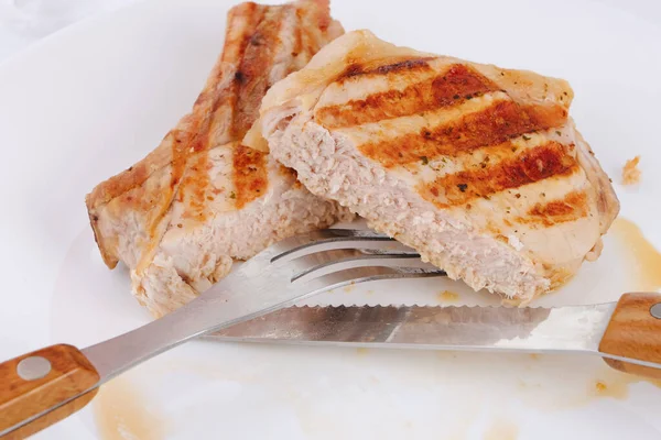Cut Two Pork Steak White Plate Knife Fork Close Macro — Stok Foto