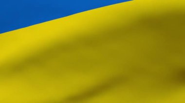 Waving yellow-blue flag of Ukraine. Close-up.