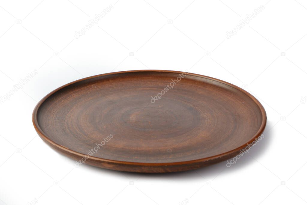 Clay plate isolated on white background. Side view.