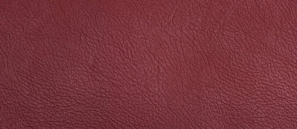 Maroon leather texture background. Wide banner format. Backdrop for design.