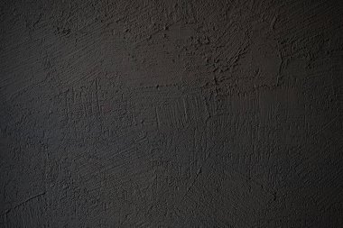 Arkaplan desenli koyu kabartmalı alçı.