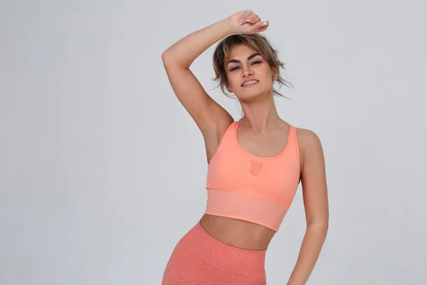 Slim Sexy Girl Pink Sportswear Isolated Gray Background — Stockfoto