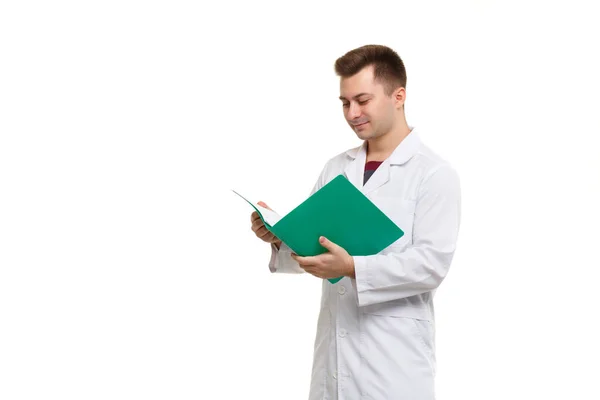 Young Handsome Doctor White Coat Looks Contents Green Folder Which — 图库照片