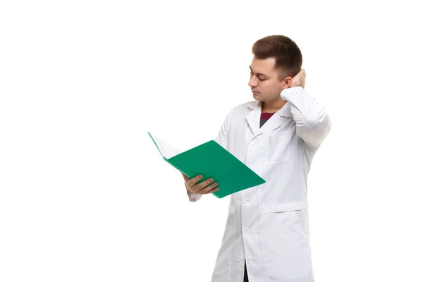 Young Handsome Doctor White Coat Thought Looking Contents Green Folder — Φωτογραφία Αρχείου