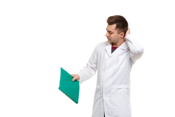 Young Handsome Doctor White Coat Holding Green Folder Isolated White — Stock fotografie