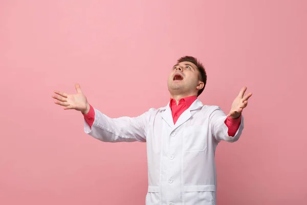Young Jubilant Doctor White Coat Pink Background — Stock Fotó