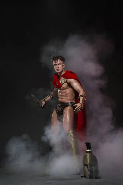 Young Athletic Sexy Man Costume Roman Warrior Red Cloak Move — Stock Photo, Image