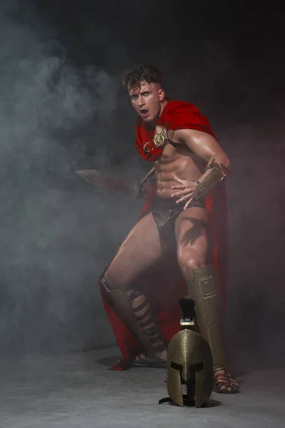 Young Athletic Sexy Man Costume Roman Warrior Red Cloak Move — Stock Photo, Image