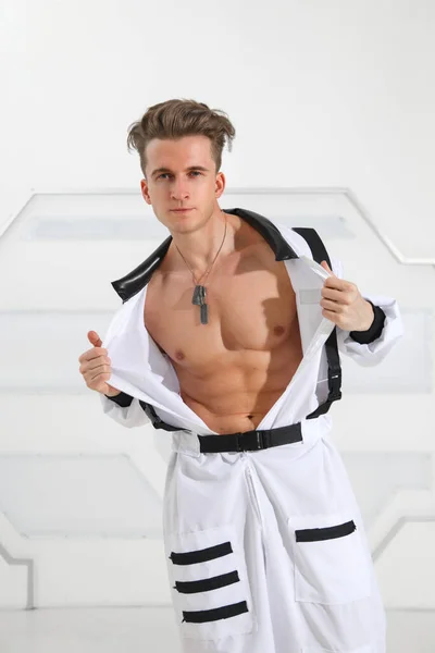 Attractive Sexy Man Takes Astronaut Jumpsuit — Stockfoto