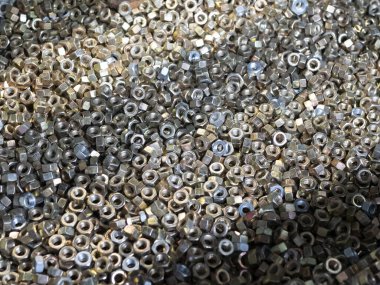 Sanayi geçmişi için parlak fındıklar ve bağlayıcılar, seçici odak