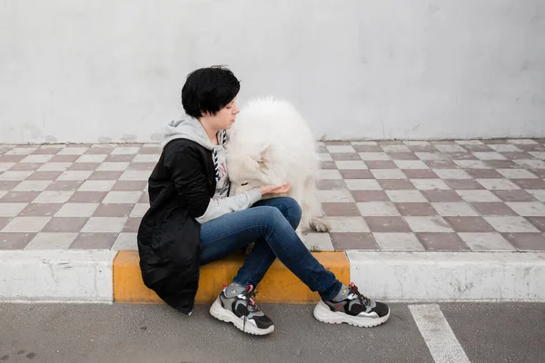 Cheerful Pretty Young Woman Sitting Hugging Her Dog — Stock Photo, Image
