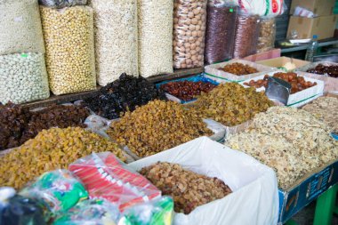 Street market in Vietnam with many products, Cereals, nuts, risins, camomilla flowers. Asia