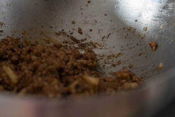 Close up of a metal bowl while preparing dough for cookies. 